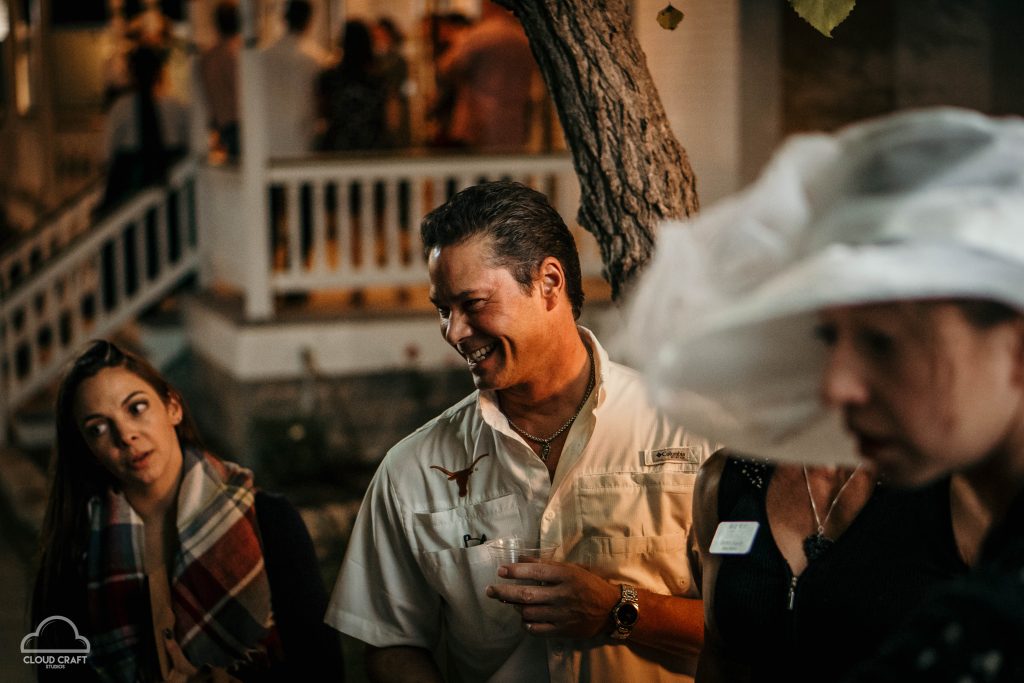 man laughing at a barbeque